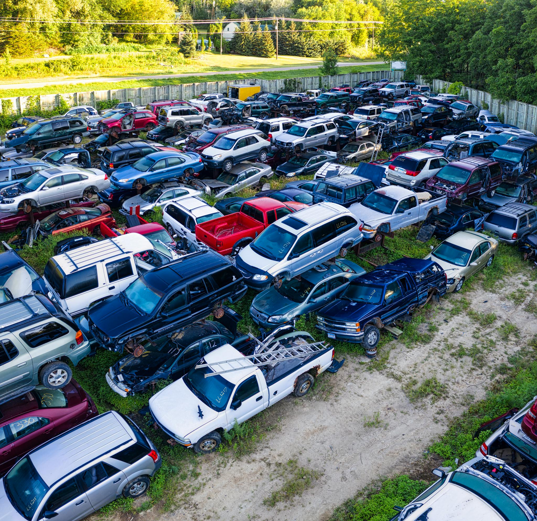 aerial shot of a vehicle junkyard with